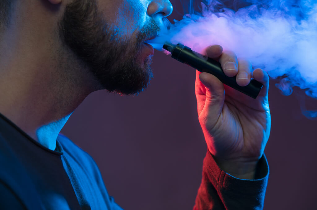 vaping-flavored-e-liquid-from-an-electronic-cigare-1